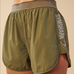 Army green Gymshark running shorts